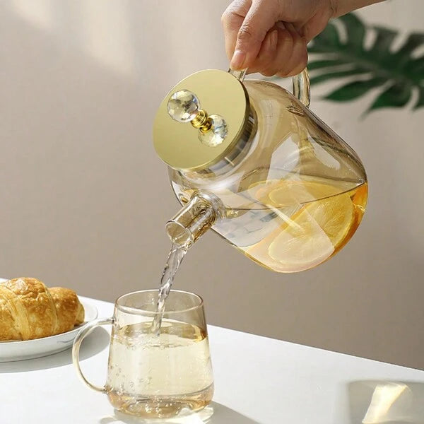 Théière en verre borosilicate avec bec filtrant amovible .
