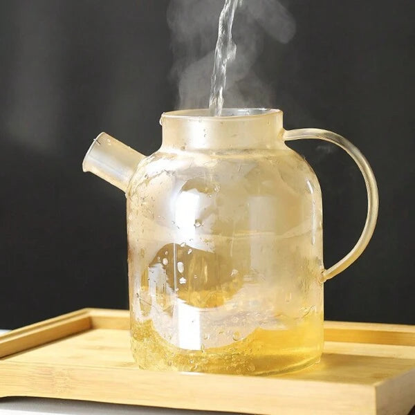 Théière en verre borosilicate avec bec filtrant amovible .
