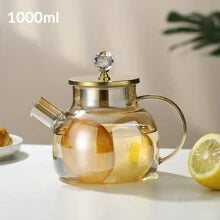 Théière en verre borosilicate avec bec filtrant amovible .