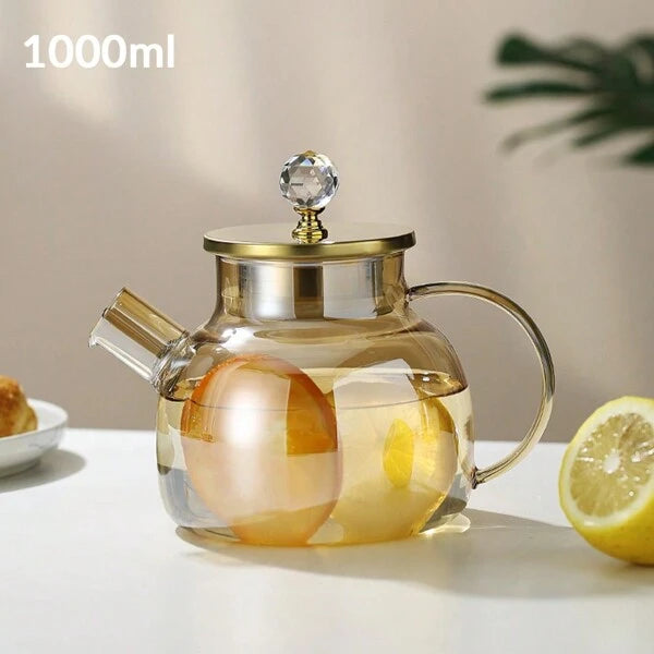 Théière en verre borosilicate avec bec filtrant amovible .